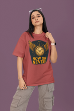 Person wearing a red t-shirt with a graphic design and text on a purple background