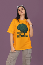 Person wearing a yellow t-shirt with a brain graphic and text on a purple background