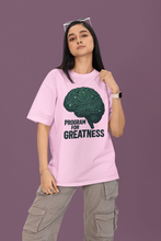 Person wearing a pink t-shirt with a brain graphic and text on a purple background