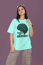 Person wearing a light blue t-shirt with a brain graphic and text on a purple background
