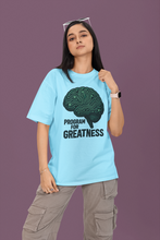 Person wearing a light blue t-shirt with a brain graphic and text on a purple background