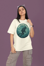 Person wearing a white t-shirt with a graphic design and text on a purple background