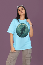 Person wearing a blue t-shirt with 'Find Your Peace' graphic design on a purple background