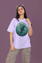 Person wearing a light purple t-shirt with a graphic design and text on a purple background