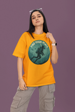 Person wearing a yellow t-shirt with a graphic design and text on a purple background
