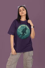 Person wearing a purple t-shirt with a graphic design and text on a purple background