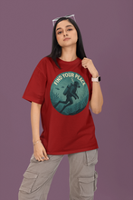 Person wearing a red t-shirt with an underwater graphic and text on a purple background