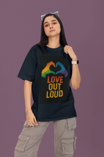 Person wearing a black t-shirt with 'Love Out Loud' design on a purple background