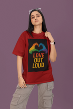 Person wearing a red t-shirt with 'Love Out Loud' graphic on a purple background