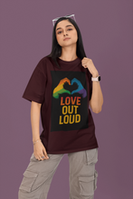 Person wearing a t-shirt with 'Love Out Loud' design on a purple background
