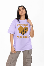 Person wearing a purple t-shirt with a heart and text design on a white background