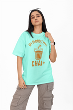Person wearing a light blue t-shirt with a humorous graphic and text on a white background