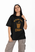 Person wearing a black t-shirt with 'My Blood Type? Chai+' text on a white background