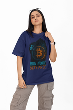 Person wearing a blue t-shirt with Bitcoin design and text