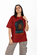 Person wearing a red t-shirt with Bitcoin graphic and text on a white background