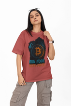 Person wearing a red t-shirt with Bitcoin graphic and text