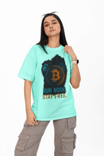 Person wearing a light blue t-shirt with Bitcoin graphic and text