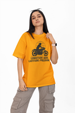 Person wearing a yellow t-shirt with a graphic and text on a white background