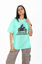 Person wearing a light blue t-shirt with a graphic design and text on a white background