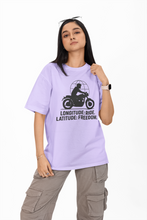 Person wearing a lavender t-shirt with a graphic design and text on a white background