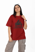Person wearing a red t-shirt with a graphic design on a white background