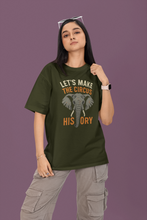 Person wearing a green t-shirt with an elephant graphic and text on a purple background