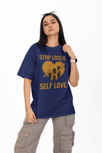 Person wearing a blue t-shirt with a motivational message on a white background