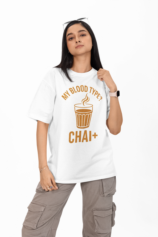 Person wearing a white t-shirt with a graphic and text, standing against a white background